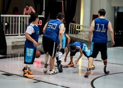 Pediatric prosthetic patients playing a game of basketball.